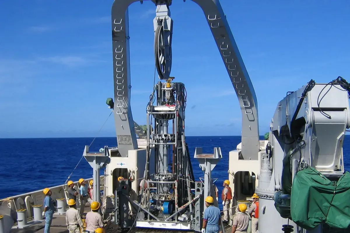 Early seafloor drill on vessel deck, crew preparing deployment