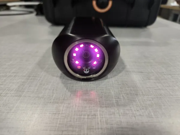 Prototype Animal-borne mini camera with purple led lights on